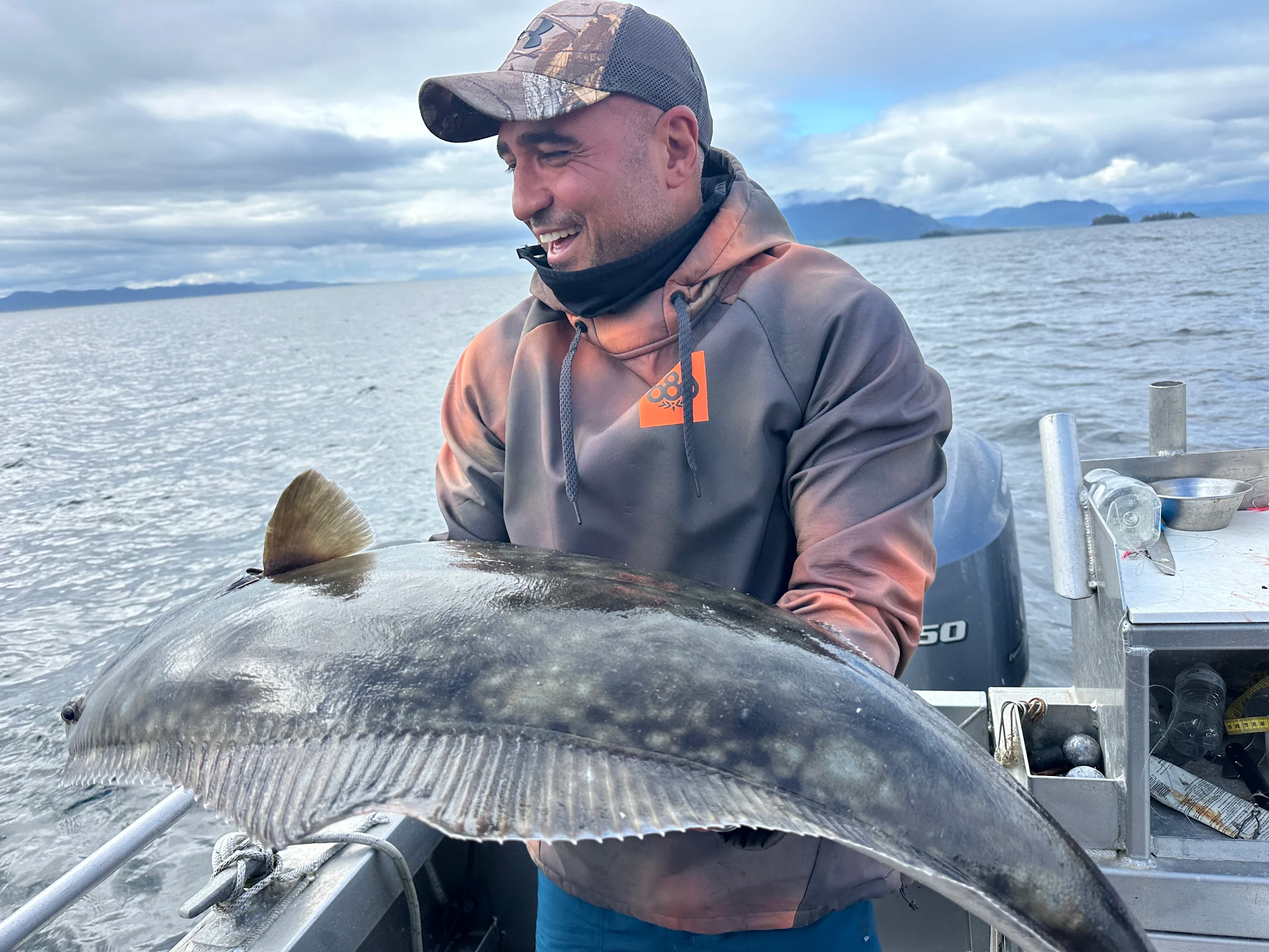Guest holding salmon on Alaska King Charter