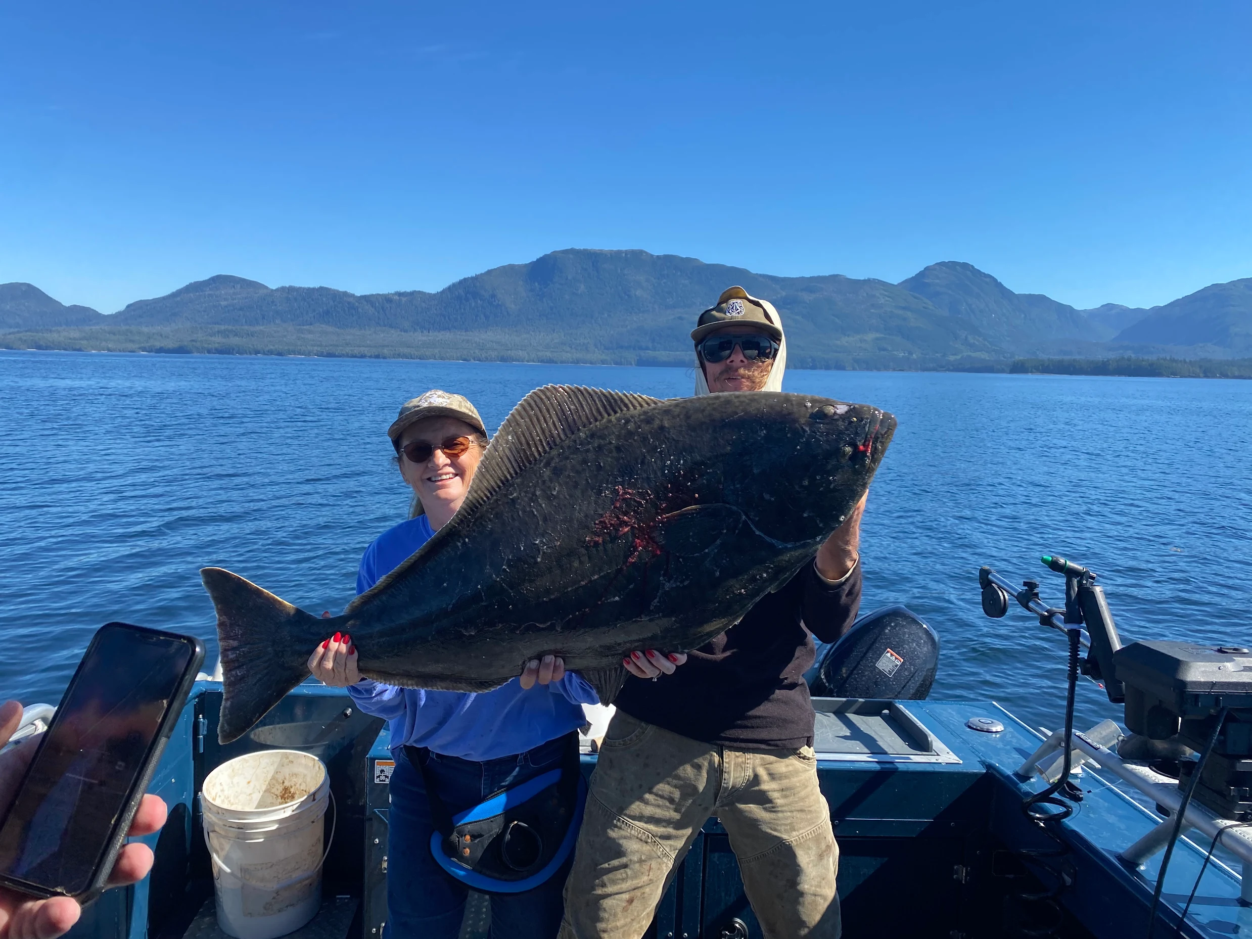 Fresh caught halibut and salmon on charter boat deck
