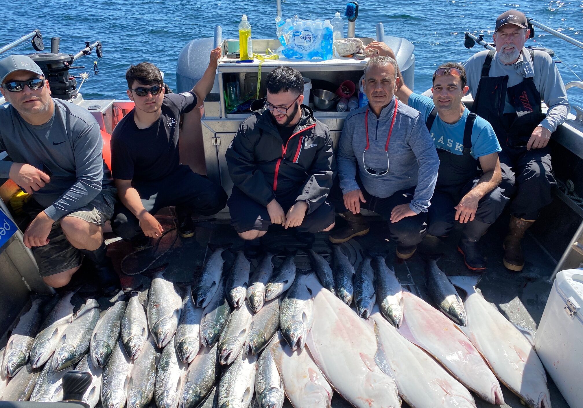 Charter boat group with dozens of caught salmon in Southeast Alaska